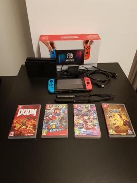 Nintendo Switch (blauw/rood) met 4 games. Zo goed als nieuw