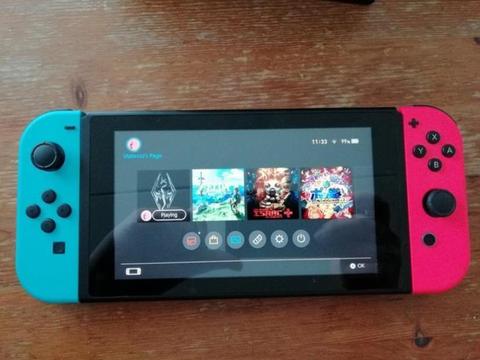 Nintendo Switch + 4 games