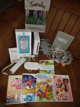 Wii spelcomputer + 5 spellen, controller en luxe nunchuck
