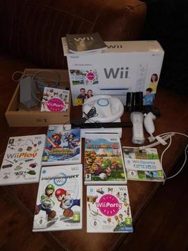 Wii met 6 spellen oa Mario Kart, Wii Party en Wii sports etc
