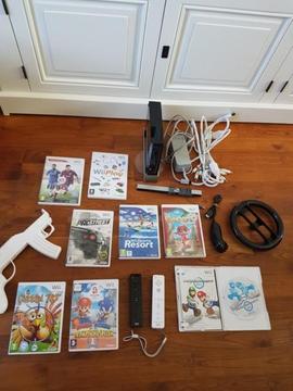 Wii met 8 wii spellen oa Mario Kart en Mario & Sonic etc